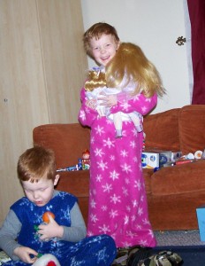 Still smiling.  Not one, but TWO porceline dolls.  If she could smile bigger, she would.